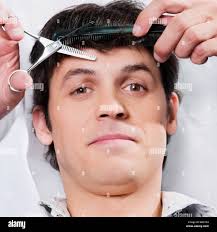 Receiving a haircut hi-res stock photography and images