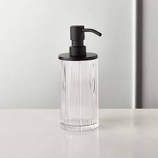 Black finished metal pump (with abs plastic parts for sitting in the liquid). Athena Black Ribbed Glass Soap Pump Reviews Cb2