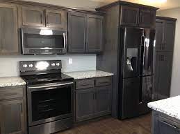 The dinner table is facing the kitchen. Dark Gray Stained Maple Judd S Custom Cabinets Facebook