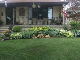 I have seen a house that i like but it is north facing. North Facing Garden Containing A Variety Of Hostas And Ferns Garden Front Of House Front Garden Design Porch Landscaping