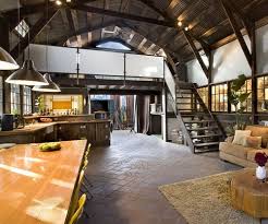 Converted Barn With More Open Space Like The Warmth Of The Brown With Yellow Accents Barn House Barn Interior Barn Living
