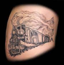 Colorful train engine in rope frame with rose tattoo design. 52 Steam Train Tattoos