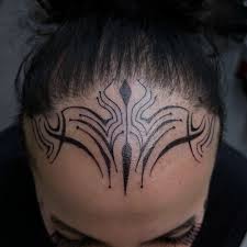 Image result for quirky pylon forehead tattoo