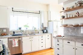 Under cabinet storage like hanging wine glass racks set stemware upside down to make use of vertical space and keep dust out. Here S How Hidden Cabinet Hacks Dramatically Increased My Kitchen Storage Apartment Therapy