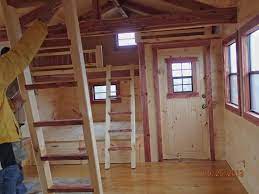 Hanging on the walls are sliding barn doors that provide entry into the bedroom and closets. 12x24 Wood Shed Turned Into Tiny Home With Loft Bedroom 4 Free Diy Plans For Building A Tiny House With Two Overhead Lofts There Is Much Additional Storage Space Hilary Freaking Yiv33