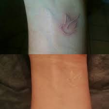 White Ink Tattoo Dove On My Wrist Top First Day Bottom After 5 Years Tinytattoo Minimal Whiteink White Tattoo White Wrist Tattoos White Ink Tattoo