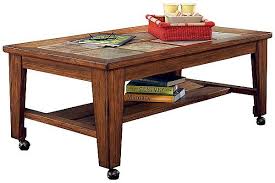 The Toscana Coffee Table W Casters From Ashley Furniture Homestore Afhs Com Rich With Rustic Beauty The Toscana Coffee Table Ashley Furniture Furniture