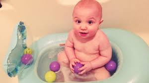 Caregiver can stand at the sink comfortably during bath time. Whale Bubble Bath Inflatable Bath Tub Blue Infantino