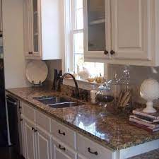 This is a very smart backsplash color selection tip. Santa Cecilia Granite Design Ideas