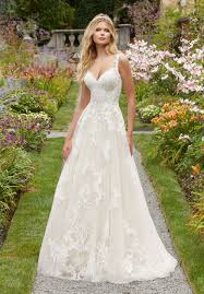 A plain fitting wedding dress with thick a lace fitting wedding dress with no sleeves and a cool illusion back on buttons for a twist is a chic idea. Wedding Dresses 2020 Fashion Dresses