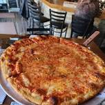 Happy Hour Pizza Paddle – Checkerboard Inn