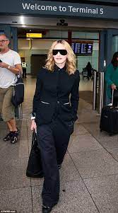 mum duties on monday morning madonna 58 flew into london to ensure rocco settled into the new school term after pop culture fashion madonna madonna pictures