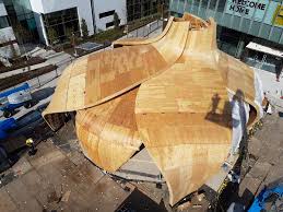 The heavy timbers are engineered from eastern white pine and precision cut with mortise and tenon joinery. The Pavilion At Great Northern Way Revolves With Cnc Milled Timber And Aluminum Composite Panels
