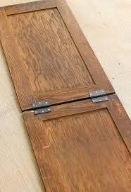 A Woman Connects 2 Old Cabinet Doors What They Become I Am So Stealing This For My Front Porch Cabinet Doors Repurposed Old Cabinet Doors Doors Repurposed