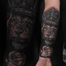 Crown tattoos symbolize royalty, power, and authority. Freshly Done Roaring Male Lion With Crown And Rose Artist Janis Anderson Lion Tattoo Animal Crown Rose Flower Realistictattoo Armtattoo Blackandgray