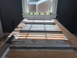 Door repurposed for ironing station. Upcycle A Reclaimed Door Into A New Table The Honest Carpenter