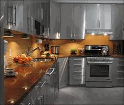 Polished Stainless Steel In Home Setting Stainless Steel Kitchen Cabinets Kitchen Cabinet Design Steel Kitchen Cabinets