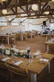 The Barn At Cott Farm An Exclusive Use Wedding Venue In Somerset Is Furnished With Handmade Tables T Country Wedding Venues Wedding Venues Farm Wedding Venue