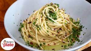 This roman spaghetti dish is a classic example of cucina povera, loosely translated as humble cooking. Spaghetti Aglio Olio E Peperoncino Pasta Aglio E Olio Recipevincenzo S Plate