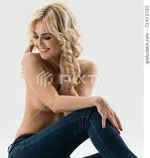 Topless model in skinny jeans on white at studio - Stock Photo [72473183] -  PIXTA