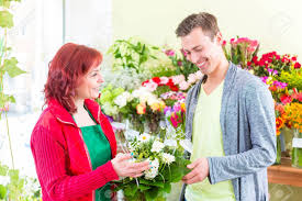 Who sells flowers near me. Female Florist Selling Man Flowers In Flower Shop Stock Photo Picture And Royalty Free Image Image 33768877