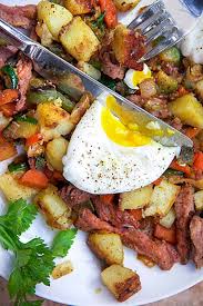 Serve the hash divided between serving plates with an egg on top. Healthy Corned Beef Hash Recipe L Panning The Globe
