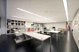 Prepossessing Long Ceiling Lamp And White Office Furniture On Dark Flooring As Modern Office C Modern Office Design Modern Office Space Design Office Interiors