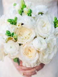 White ranunculus flowers on white wooden background. 16 Stunning Ranunculus Bouquets