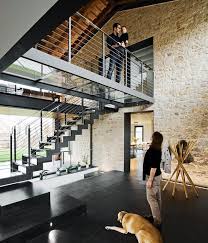 Locally Sourced Italian Slate Covers The Ground Floor Rooms The Coat Rack Near The Entrance Is From Zanotta Photo By He Maison En Pierre Idees Loft Mezzanine