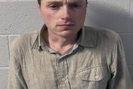 Person of interest in couple's death now accused of murder