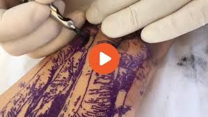 A woman in pink gloves makes a tattoo on the leg of a take me to shutterstock. Video Gallery Lacenano