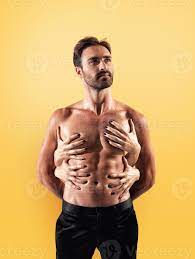 Sexy man touched by multiple woman hands 20628147 Stock Photo at Vecteezy