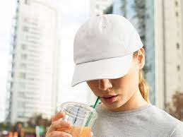 Dad Hat Mockup Of A Woman With A Beverage Free Mockup