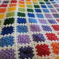 Knits are in soft colors. My Rainbow Granny Square Blanket Knitting Bee Instagram Crochet Blanket Rainbow Crochet Granny Square Blanket Crochet Granny Square Blanket Color