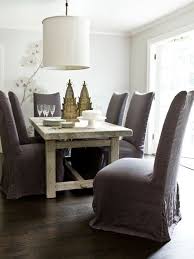 A Rustic Farm Table Meets Sophisticated Dining Chairs In This Peaceful Dining Room Via Ho Eclectic Dining Room Dining Room Table Chairs Slipcovers For Chairs