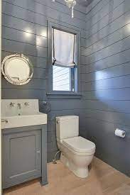 And a perfect place to pack a punch is in your powder room! Blue Shiplap Powder Room Cottage Bathroom