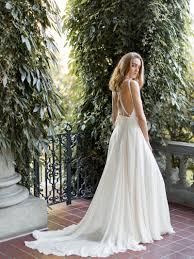 We Re Swooning Over The Criss Cross Back On This Long Flowy Wedding Dress Modern Silk Bridal Gown Iv Wedding Dress Flowy Wedding Dresses Silk Bridal Gown