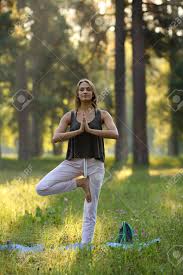 Maybe you would like to learn more about one of these? Beautiful Girl Standing On One Leg In Yoga Pose Hands Folded As In Prayer Stock Photo Picture And Royalty Free Image Image 71494204