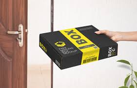 A cover presentation mockup showing a male hand holding a magazine. Free Hand Holding Mailing Box Mockup Free Package Mockups
