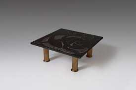 The coffee table has a white, marble tabletop and black, iron table base. Engraved Black Granite And Gold Coffee Table By Guy De Jong 1989 For Sale At Pamono