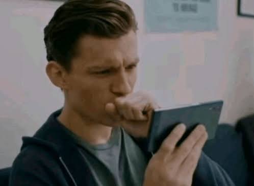Tom Holland Tom Hollond Looking On Phone Meme - Tom holland Tom hollond  looking on phone Spiderman - Discover & Share GIFs