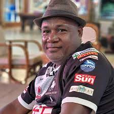 What could be causing my car audio system to lose bass at high volume?