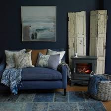 Housetohome The Fisherman S Cottage Look Is Modernised Here By Denim Upholstery And Warming I Blue Living Room Blue Living Room Decor Indigo Blue Living Room