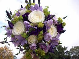 Wedding arrangement with white roses, carnation, and greenery. 16 Freesia Bouquet Ideas Wedding Bouquets Wedding Flowers Bridal Bouquet