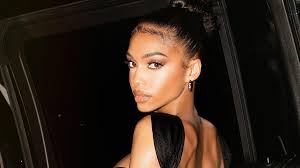 Lori Harvey's Red Lipstick Is The Perfect Pop To Her All-Black Outfit