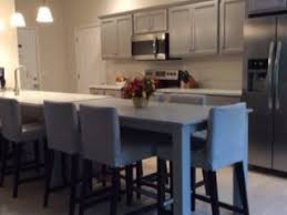 The small island provides extra storage, when extra kitchen space is unavailable. Merillat Classic Spring Valley Maple Peltcs Lumber Co Facebook