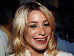 FBI: Widow held in murder-for-hire scheme eight years after tycoon's slaying