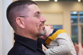 SWEET MOMENT: As Sgt. Maranda Baker was called up last night to be honored  as the 2021 Officer of the Year, Officer Josh Morgan stepped in to scoop up  Sgt. Baker's son,