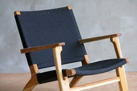 Mid Century Modern Inspired Solid Wood Arm Chair With Hand Woven Black Manila Cotton Seating Surface Thi Chair Mid Century Modern Lounge Chairs Wood Arm Chair