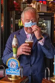 Prince Charles laughs as he struggles ...